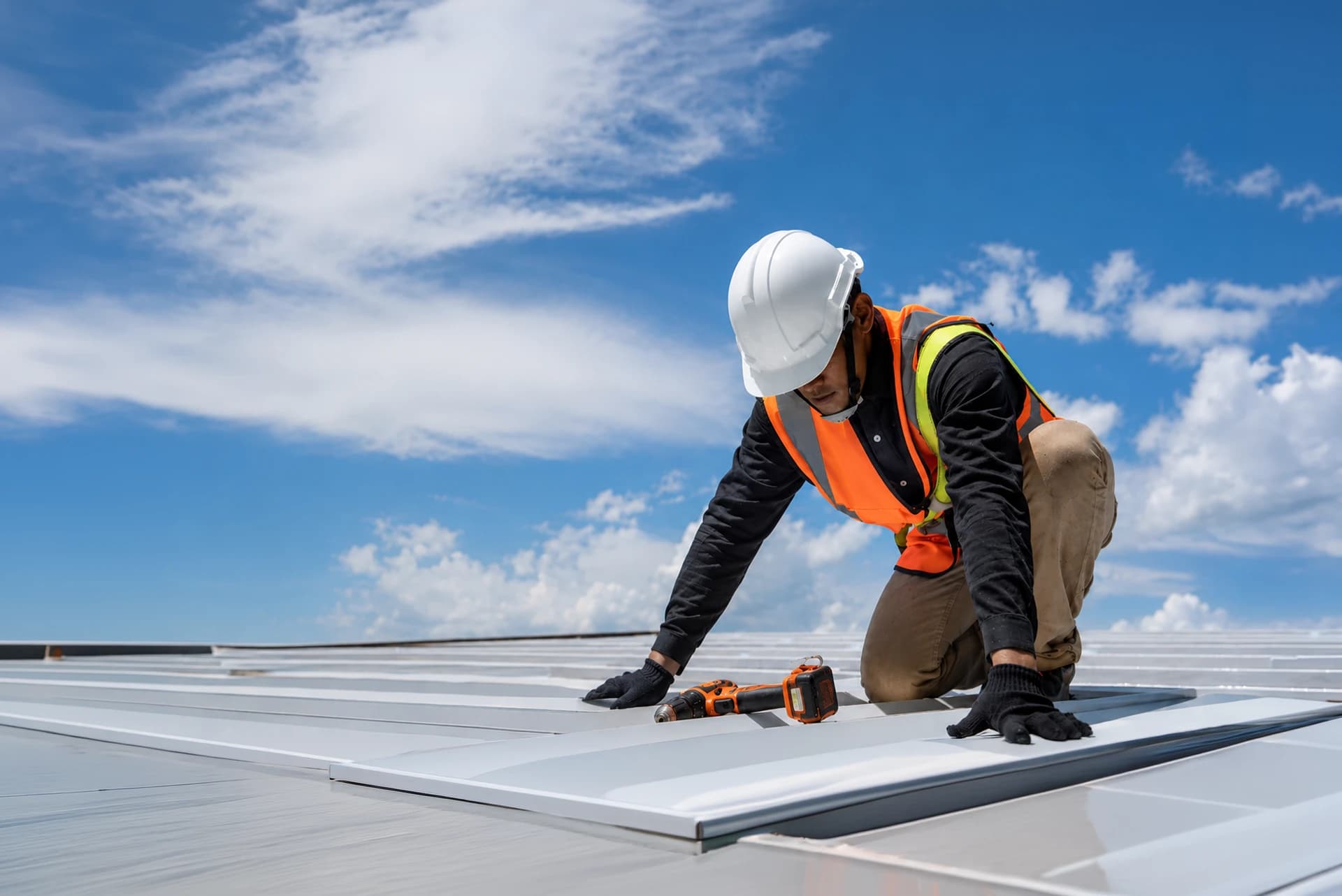 Roofer installing a new roof